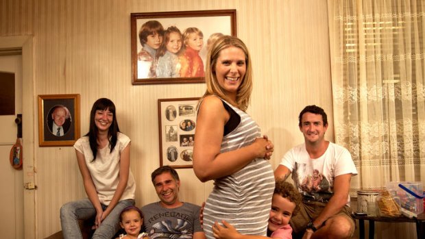 Surrogate mother Kim Graham, with brother Shane and sister-in-law Katherine on the left and husband Justin on the right.