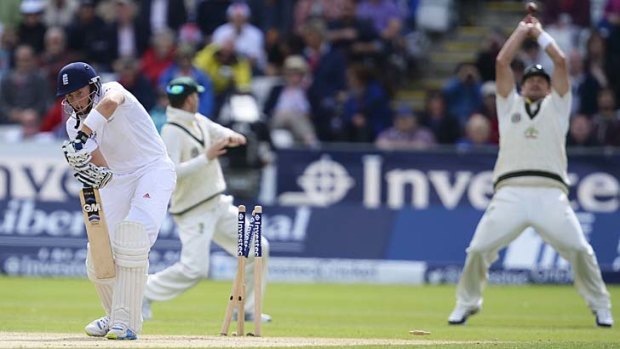 England opener Joe Root is bowled by Ryan Harris (not in picture) shortly before lunch on day three of the fourth Test.