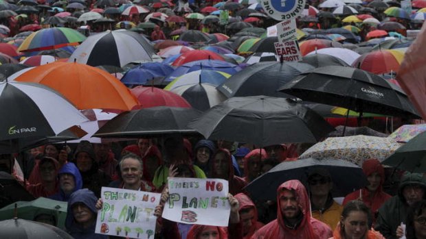 Rain, hail or shine: Protesters came out in force in Sydney, despite the wet weather.
