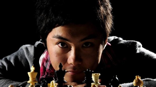Canberra's Junta Ikeda takes part in the 50th Doeberl Cup chess tournament held at the Hellenic Club, Woden.