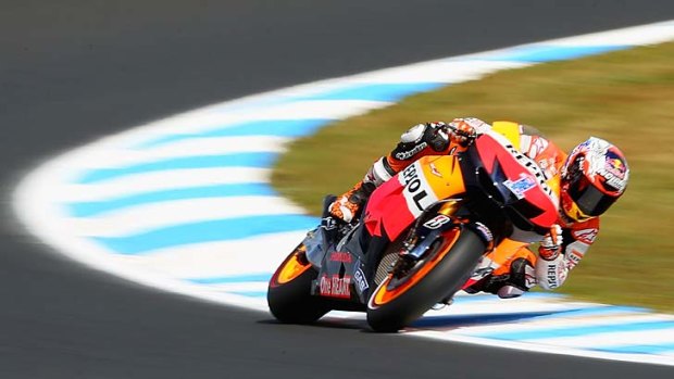 In the name of the master ... Casey Stoner roars past his eponymous corner at Phillip Island yesterday.