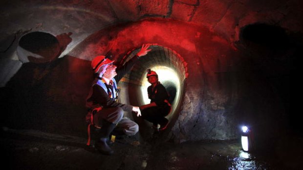 A river runs under it: Hydro engineer John Breen gives archaeologist Yvonne Kaiser-Glass a tour down under.