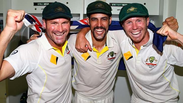 Ryan Harris, Mitchell Johnson and Peter Siddle of Australia celebrate after winning back the Ashes.