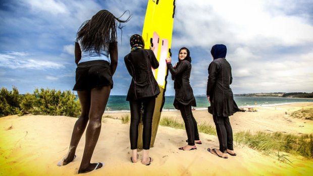 Nyadak Gatluak , Fereshtah Mohammadi, Aisha Shahbazfetes and Maida Kanwal from Cranbourne Secondary head to their surfing lesson at Point Leo.