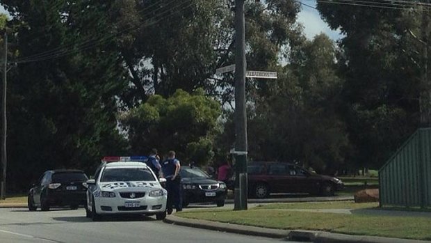 Police assemble at the corner of Woodpecker Avenue and Albatross Pass in Willetton, where they are involved in a stand-off with an armed man. <b>Photo:</b> Ryan Northover.