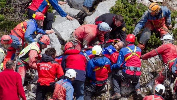 First light: Mountain rescuers carry Johann Westhauser out of the Riesending cave.