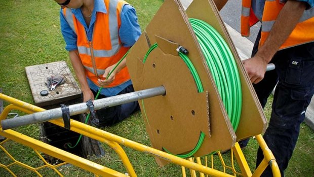 Rolling out fibre optic cable. 