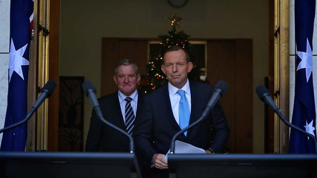 Prime Minister Tony Abbott with Industry minister Ian Macfarlane during a press conference in Canberra on Wednesday.