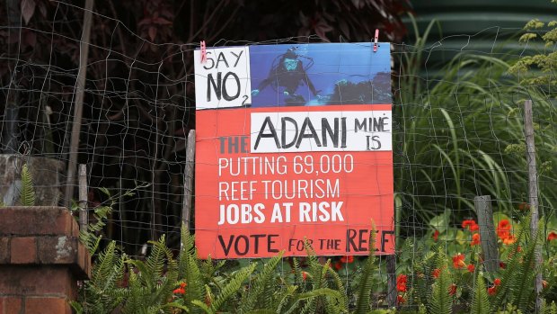 A sign protesting against the Adani mine in South Brisbane.