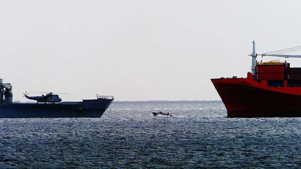 Refugees are transfered from the MV Tampa to the HMAS Manoora.