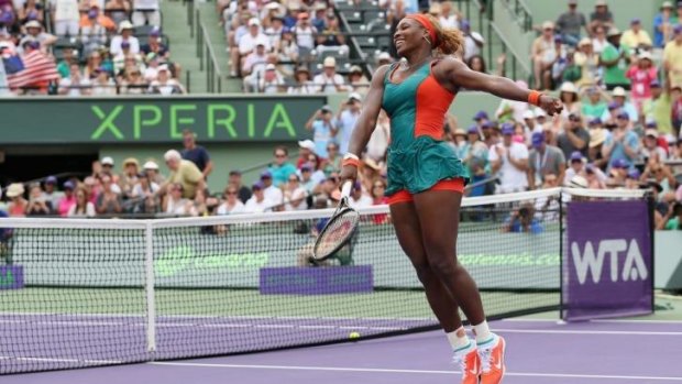 Jump for joy: Serena Williams celebrates defeating Li Na.