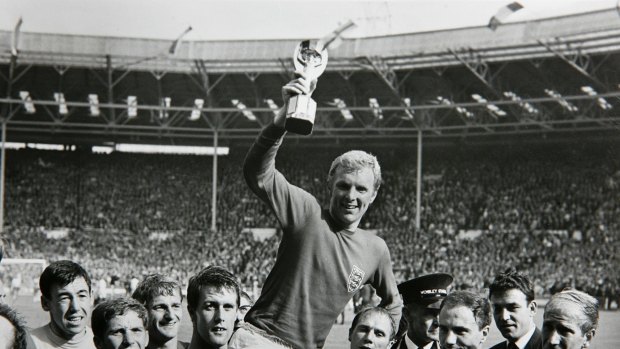 That's gold: Bobby Moore, the England captain, holds the Jules Rimet trophy after beating West Germany to win the World Cup in 1966. 