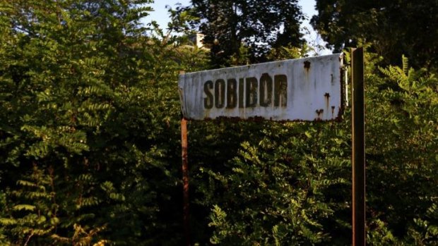 A rusty road sign is seen outside the perimeter of the Nazi's Sobibor death camp in Poland.