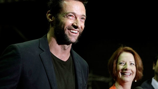 Prime Minister Julia Gillard, right, with Hugh Jackman on the set of <i>The Wolverine</i> in July.