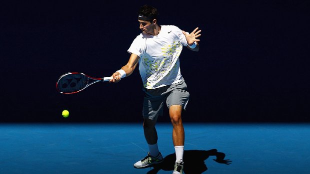 Bernard Tomic hits a forehand during his first-round battle with Spain's Fernando Verdasco.