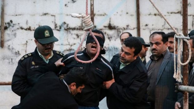 Balal, who killed Abdolah Hosseinzadeh in a street fight with a knife in 2007, is brought to the gallows during his execution ceremony.