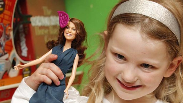 Five year old Amy Hendriksen poses with the limited edition <i>Princess Catherine Engagement Doll</i> during its launch at Hamleys toy shop in London.