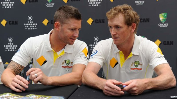 Michael Clarke and George Bailey chat during a fan day in Brisbane on Monday.