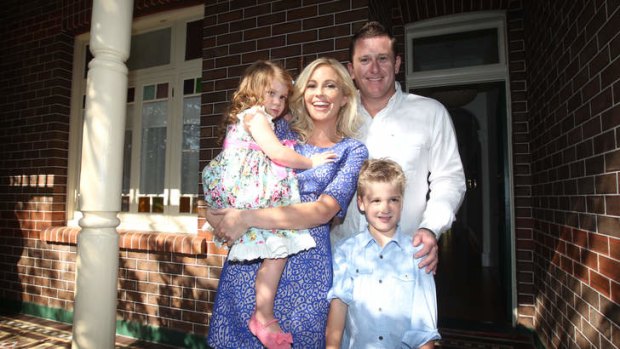 Phil Rankine and his wife Amity Dry, with their two children, at <i>The Block: All Stars</i> auction in Bondi.