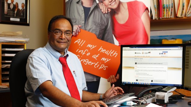 Dr Mukesh Haikerwal, former head of the Australian Medical Association, signing up patients to the new national e-Health system at his surgery in Altona, Victoria, in December 2012.