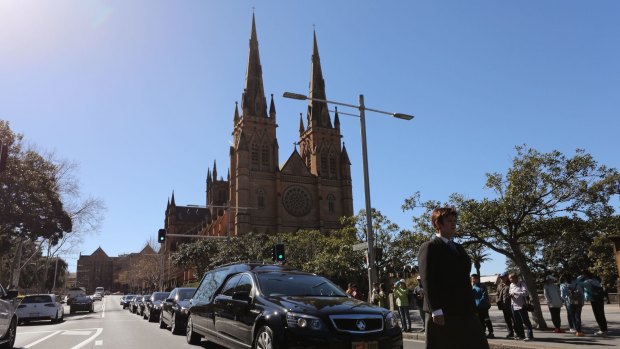 The hearse of John Johnson leaves at the end of the State Funeral for The Honourable John Richard Johnson at St Mary's Cathedral.