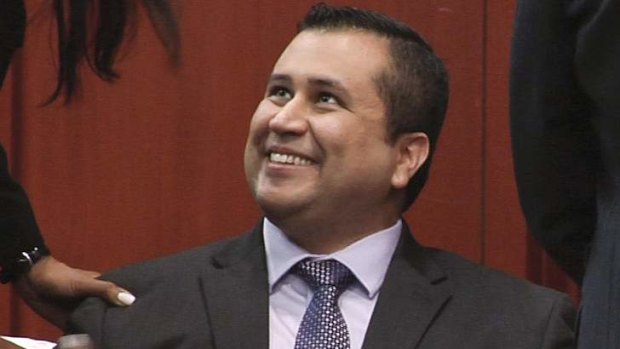 Not guilty: George Zimmerman smiles after his acquittal.
