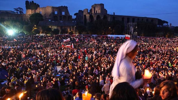 Pilgrims attend a prayer vigil on the eve of the beatification ceremony in Rome.