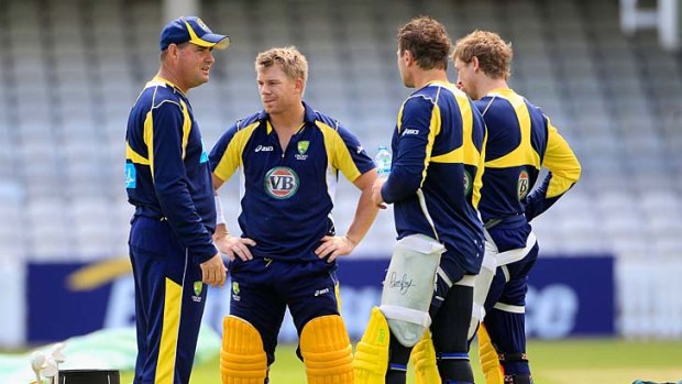 Mickey Arthur talks to members of the Australian cricket team.