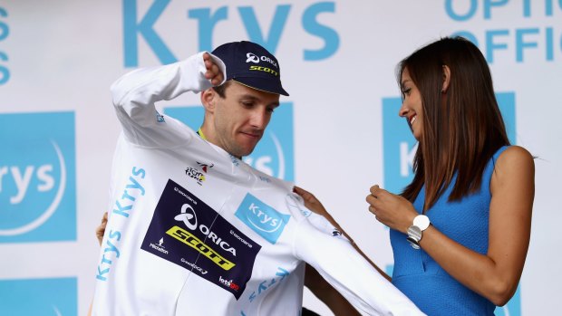Simon Yates pulls on the white jersey for best young rider after stage 13 from Saint-Girons to Foix on Friday.