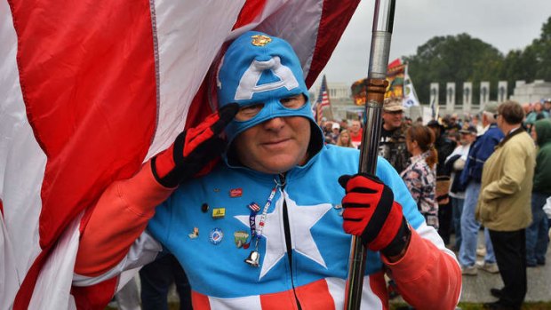 A protester dressed as comic book super hero "Captain America" joins veterans during a demonstration against the government shutdown at the World War II memorial in Washington, DC.