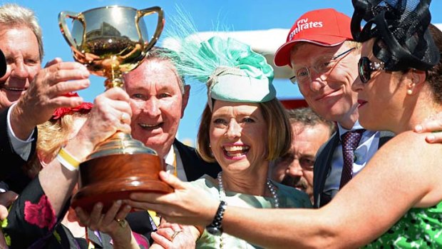First time winner: Gai Waterhouse, centre, celebrates with the trophy after winning the Melbourne Cup.