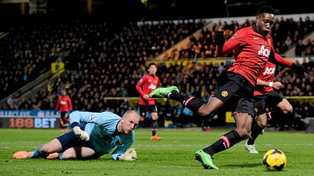 Round the keeper: Manchester United's Danny Welbeck prepares to stroke home what proved to be the winner at Norwich.