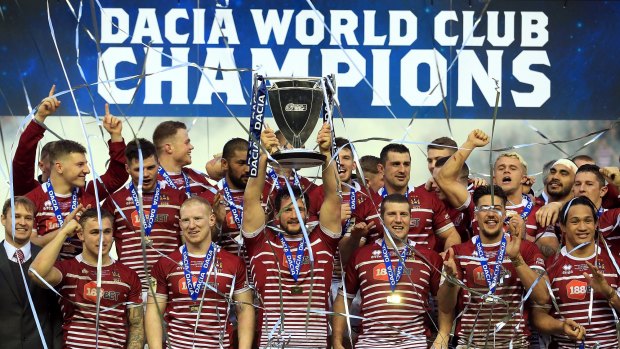 World champions: Wigan celebrate the famous victory over the Cronulla Sharks in February.