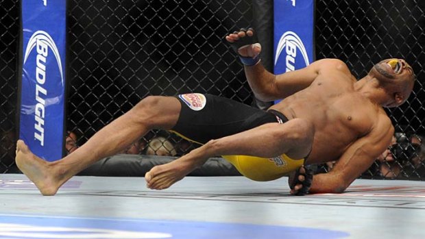 Anderson Silva screams in pain as a kick on Chris Weidman goes horribly wrong at UFC 168 in Las Vegas.