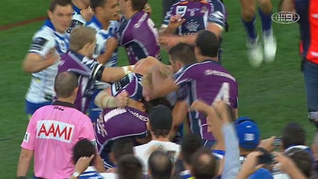 Fight club ... James Graham appears to bite the ear of Billy Slater during a brawl.