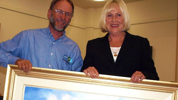 Look closer ... John Barraclough eventually presented the specially-commissioned painting of the Wonthaggi plant.