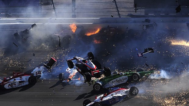 Australian driver Will Power's Honda goes airborne as part of a massive 15-car pile-up in Las Vegas.