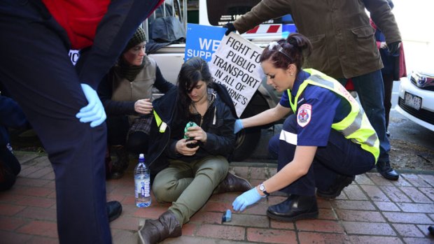 Injured ... East-west link protester Kat Galea after a clash with police outside the John Holland office in Collingwood.