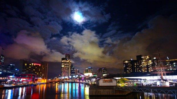 Reader Ockert le Roux took this photo of the "supermoon" over Melbourne's South Wharf about 7.45pm on Saturday when the clouds parted briefly.