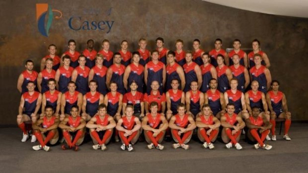 Top of bucket list: Tom Wood is glanked by Dean Bailey and James McDonald in a 2009 Melbourne team photo.
