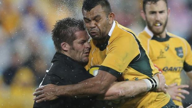 Crash course: All Blacks captain Richie McCaw collides with Wallaby Kurtley Beale  on Saturday. 