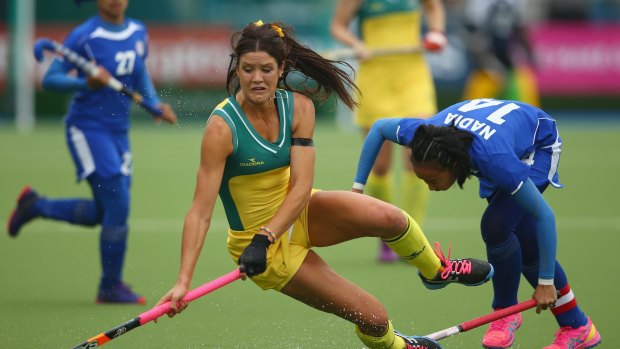 Australia's Anna Flanagan falls as she is tackled.