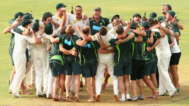 Nathan Lyon of Australia leads the team song on the pitch after winning the Ashes back.