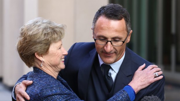 Handover: Former Greens leader Senator Christine Milne embraces her successor, Senator Richard Di Natale.