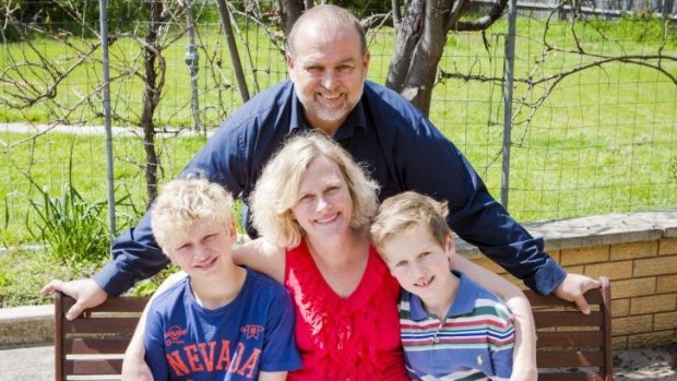 Canberra Mother of two Megan James, centre, has been twice diagnosed with breast cancer. She  pictured with sons Griffin 10, left, and Dylan 8, right, and David Hutchins, rear.
