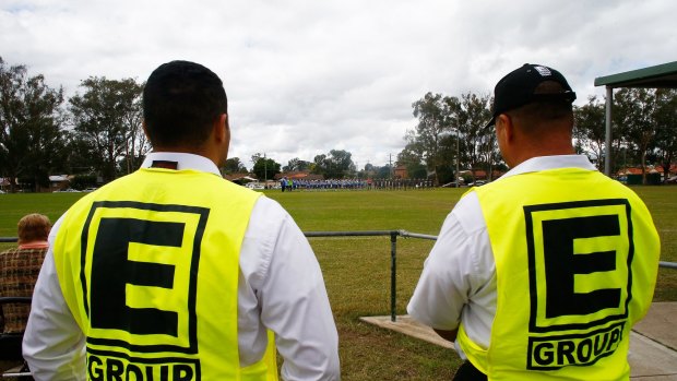 Security guards patrol a Junior League match at Allsopp Oval in Penrith on Saturday.