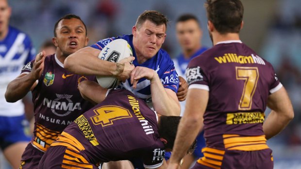Back from injury: Brett Morris is tackled during the round 16 NRL match between the Canterbury Bulldogs and Brisbane Broncos at ANZ Stadium.