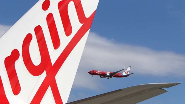 Virgin Australia has dropped the prices of its business-class fares in the escalating domestic airline price war.