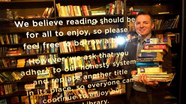 Melbourne Central's Justin Shannon in the Little Library at the shopping centre that operates on an honour system.