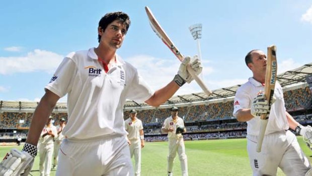 Alastair Cook and Jonathan Trott acknowledge the applause of the crowd after an unbeaten stand of 329 runs at the Gabba yesterday.